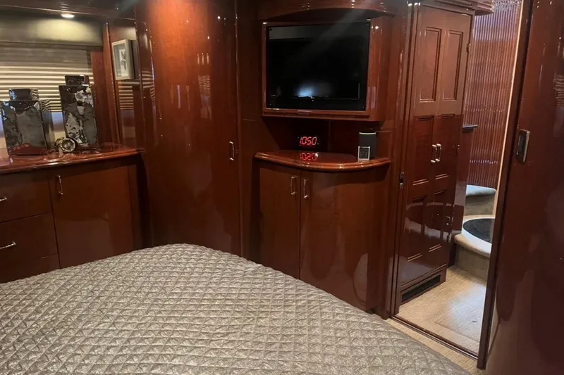 Slide: The Image of Luxurious 2005 Marquis Pilothouse interior with wood cabinetry and modern amenities. - 8
