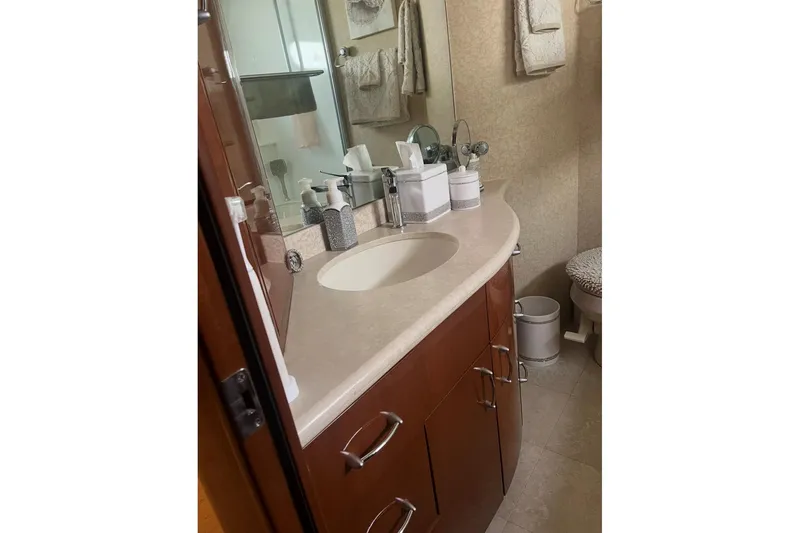 Slide: The Image of Luxurious bathroom in a 2005 Marquis Pilothouse yacht with elegant fixtures and cabinetry. - 9