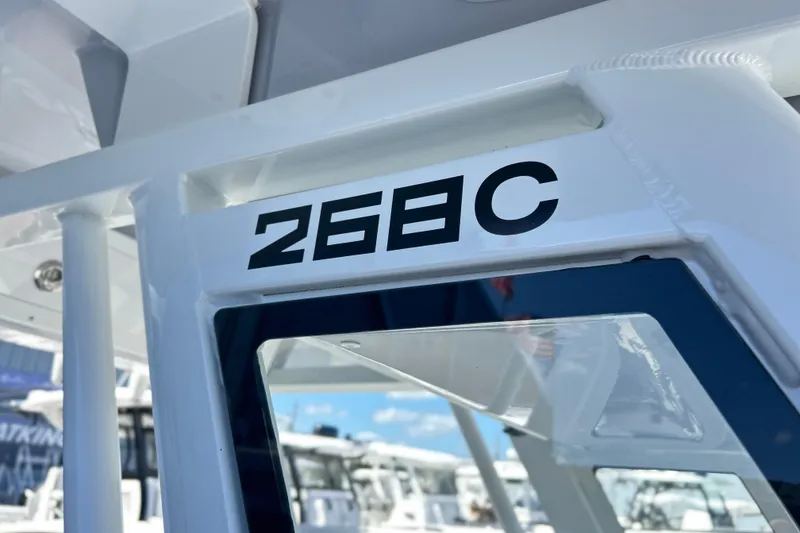 Slide: The Image of 2026 Sea Fox 268 Commander boat interior with white cushioned seating. - 11