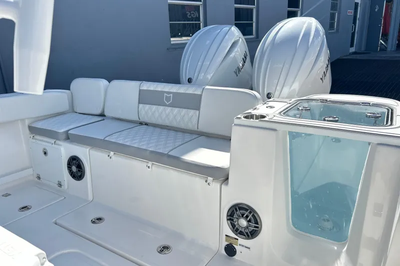 Slide: The Image of 2026 Sea Fox 268 Commander boat interior with cushioned seating and dual Yamaha engines. - 15