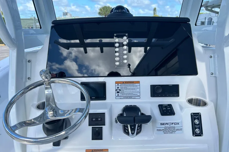 Slide: The Image of Control panel of 2026 Sea Fox 268 Commander with Simrad displays and Yamaha gauges. - 2
