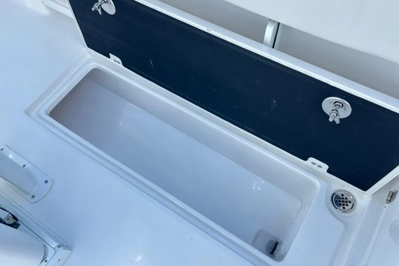 Slide: The Image of Open storage compartment on 2026 Sea Fox 268 Commander boat deck. - 20