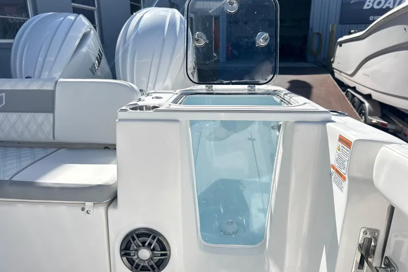 Slide: The Image of White YETI cooler on 2026 Sea Fox 268 Commander boat deck. - 23