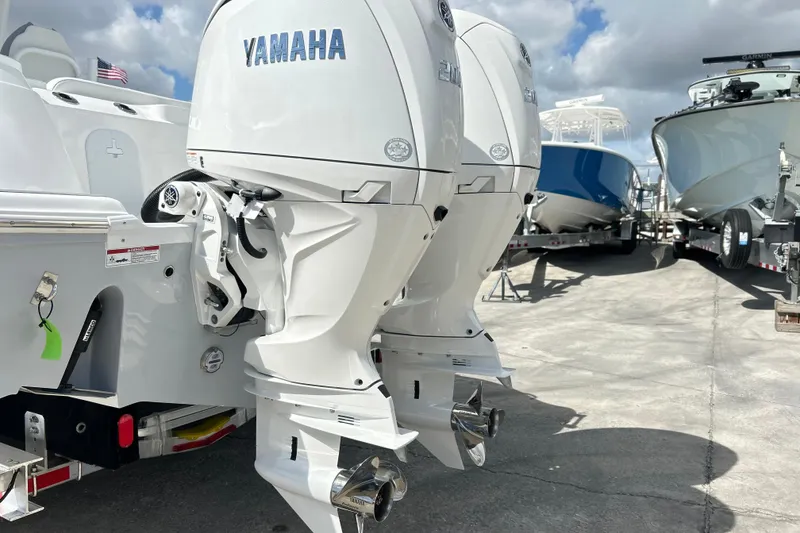 Slide: The Image of 2026 Sea Fox 268 Commander boat interior with open storage compartment and Yamaha engines. - 24