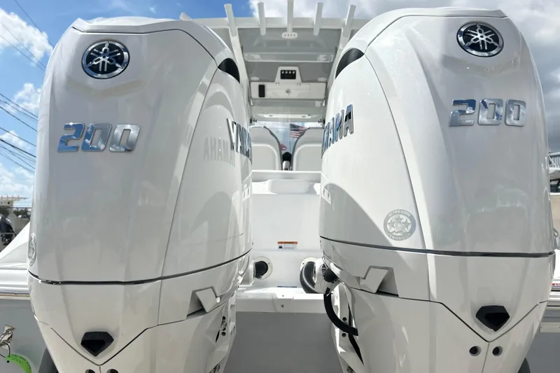 Slide: The Image of Twin Yamaha outboard engines on a 2026 Sea Fox 268 Commander boat, dockside view. - 25