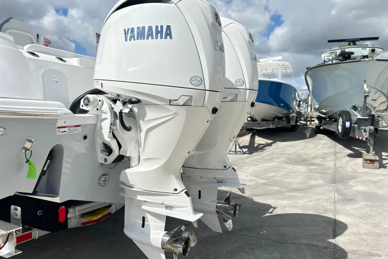 Slide: The Image of 2026 Sea Fox 268 Commander boat with dual Yamaha outboard engines, parked on a trailer. - 27