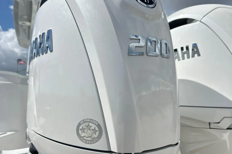 Slide: The Image of Twin Yamaha outboard engines on a 2026 Sea Fox 268 Commander boat, dockside view. - 28