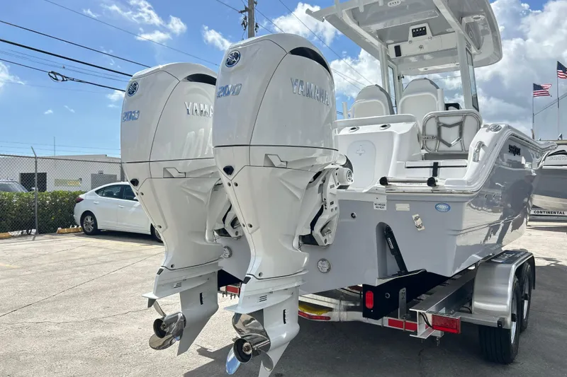 Slide: The Image of 2026 Sea Fox 268 Commander boat logo against a clear blue sky. - 32