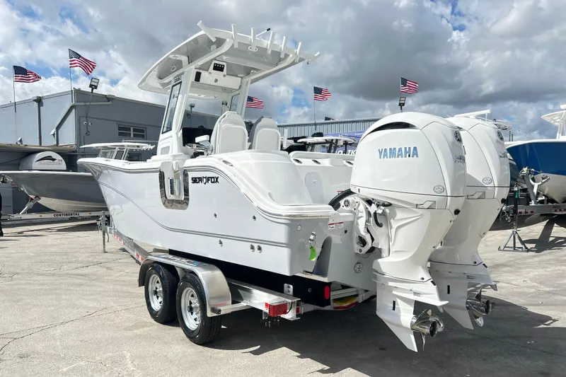Slide: The Image of 2026 Sea Fox 268 Commander boat with dual Yamaha engines on a trailer. - 34