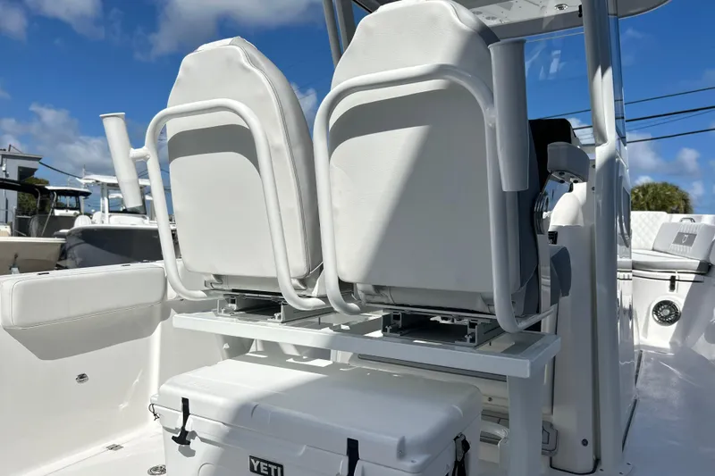 Slide: The Image of 2026 Sea Fox 268 Commander boat seats, white upholstery, outdoor setting. - 4