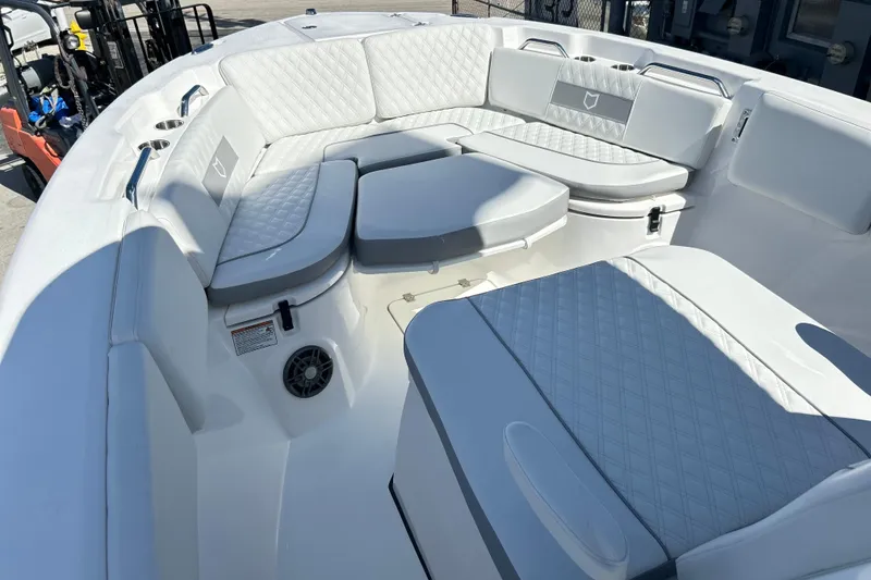 Slide: The Image of 2026 Sea Fox 268 Commander boat interior with luxurious white seating and cup holders. - 8