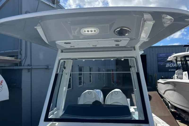 Slide: The Image of 2026 Sea Fox 268 Commander boat interior with cushioned seating and cup holders. - 9