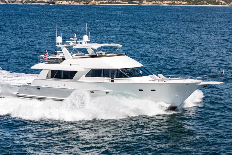 Slide: The Image of Northcoast Yachts Raised Pilothouse 1999 cruising on open water, showcasing sleek design and elegance. - 1