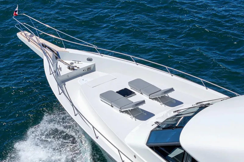 Slide: The Image of Luxurious Northcoast Yachts Raised Pilothouse cruising on open water, 1999 model. - 12