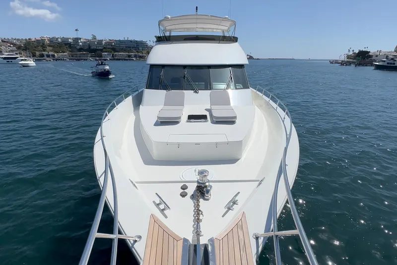 Slide: The Image of Luxurious Northcoast Yachts Raised Pilothouse, 1999 model, cruising on serene waters. - 13