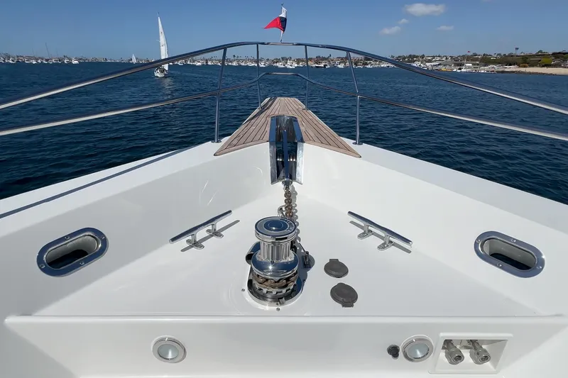 Slide: The Image of Bow view of Northcoast Yachts Raised Pilothouse, 1999 model, anchored in a scenic harbor. - 15