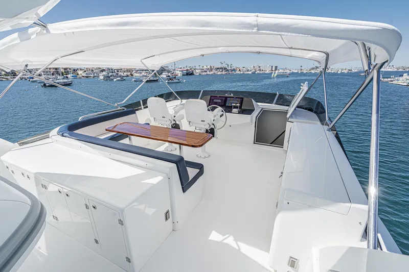 Slide: The Image of Luxurious Northcoast Yachts Raised Pilothouse 1999/2024 with spacious deck and seating area. - 21