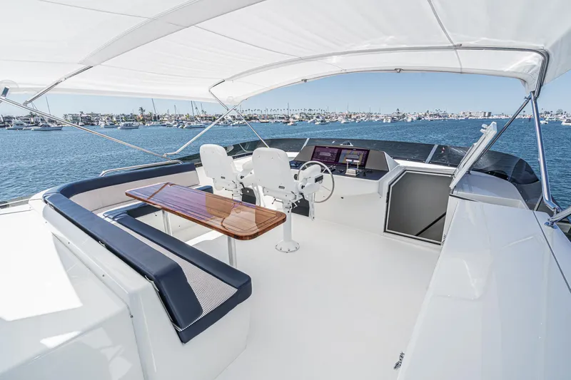 Slide: The Image of Luxurious Northcoast Yachts Raised Pilothouse 1999, featuring spacious helm and seating area. - 22