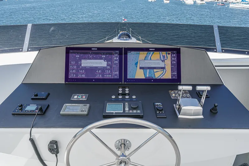 Slide: The Image of Raised pilothouse helm of Northcoast Yachts, model 1999/2024, with navigation screens and controls. - 25