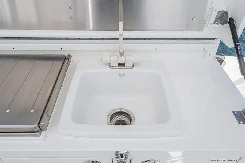 Slide: The Image of White sink and faucet on Northcoast Yachts Raised Pilothouse 1999/2024. - 30