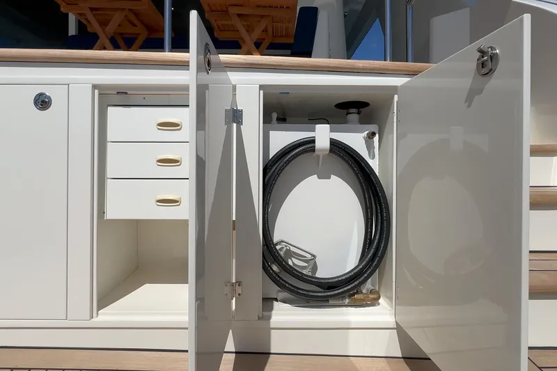 Slide: The Image of Open storage compartment on a Northcoast Yacht, Raised Pilothouse 1999/2024 model. - 44