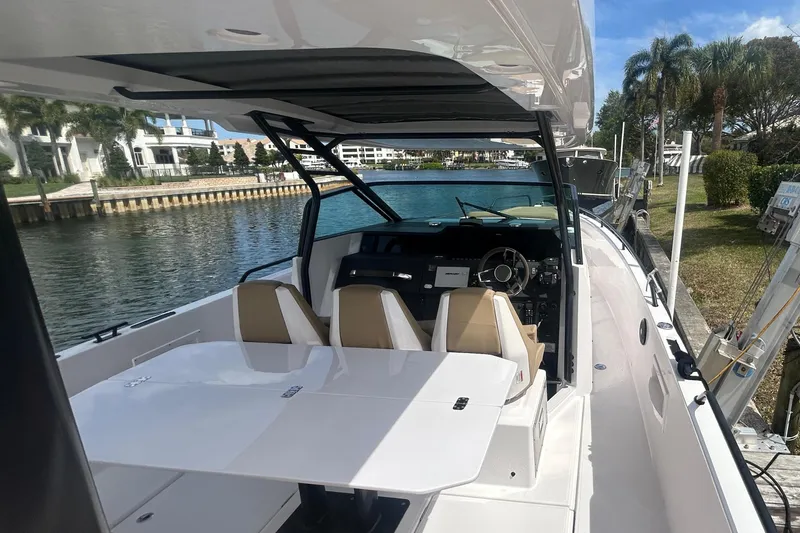 Slide: The Image of Axopar 37 Sun-Top 2021 boat docked with interior view. - 10