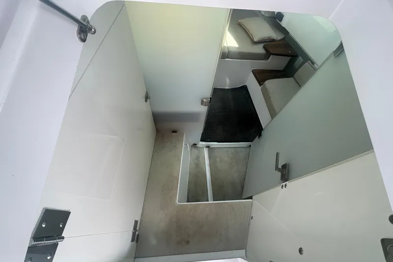 Slide: The Image of 2021 Axopar 37 Sun-Top cabin interior with modern design and comfortable seating. - 14