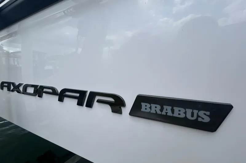 Slide: The Image of Axopar 37 Sun-Top 2021 boat with Brabus badge on white hull. - 3
