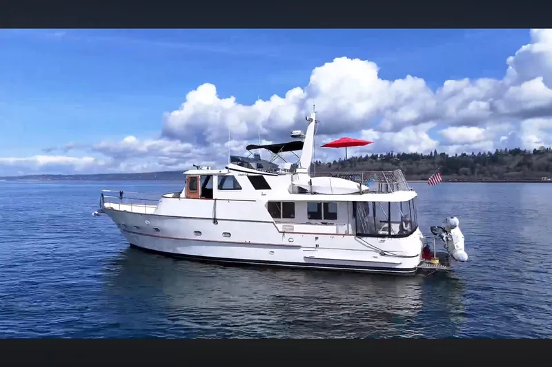 The Image of 2002 Transpacific Marine EAGLE 53 yacht on calm water under a blue sky. - 0