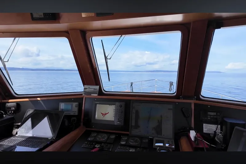 Slide: The Image of Interior view of 2002 Transpacific Marine EAGLE 53 yacht cockpit with navigation equipment. - 10