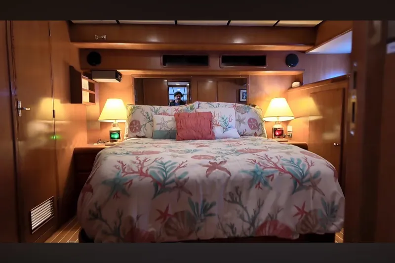 Slide: The Image of Luxurious bedroom interior of 2002 Transpacific Marine EAGLE 53 yacht with cozy bedding. - 17