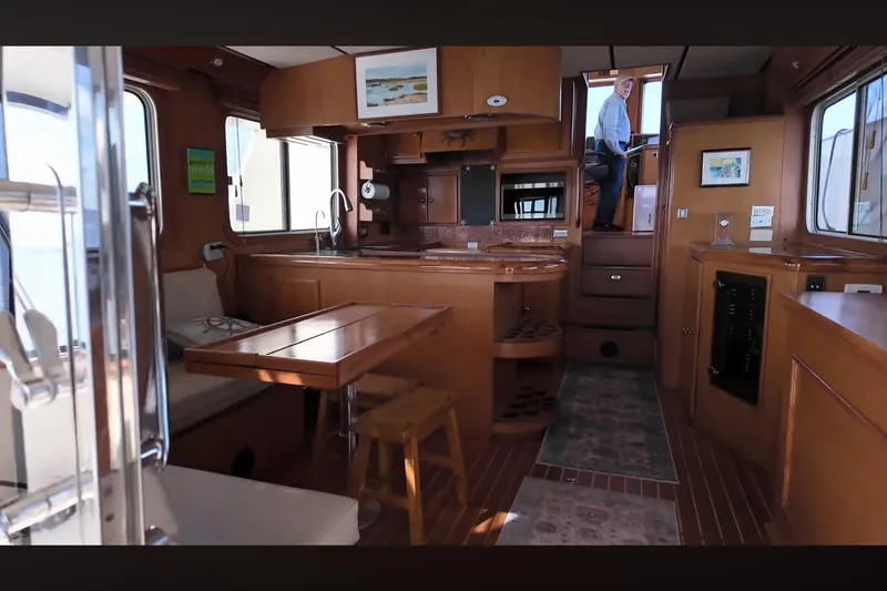Slide: The Image of Luxurious interior of 2002 Transpacific Marine EAGLE 53 yacht with wood finishes and modern amenities. - 3
