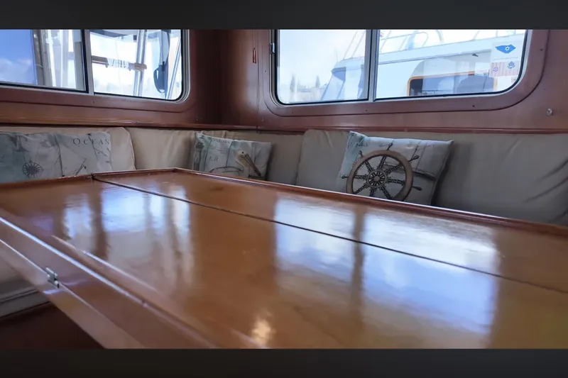 Slide: The Image of Luxurious interior of 2002 Transpacific Marine EAGLE 53 yacht with polished wood table. - 6
