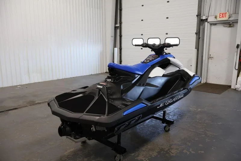 Slide: The Image of 2026 Yamaha WaveRunner JetBlaster in a garage, showcasing sleek design and vibrant blue accents. - 25