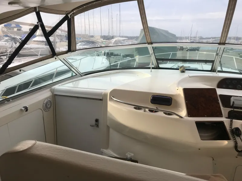 Slide: The Image of Interior view of 1995 Sea Ray 450 Sundancer yacht cockpit with helm and controls. - 23