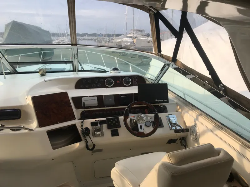 Slide: The Image of Interior helm of 1995 Sea Ray 450 Sundancer yacht with steering wheel and navigation equipment. - 24