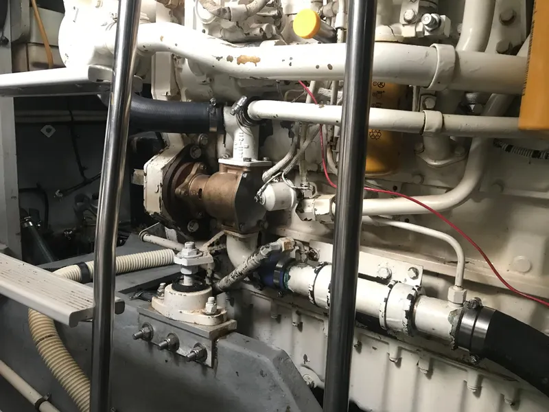 Slide: The Image of Engine compartment of a 1995 Sea Ray 450 Sundancer boat, showcasing mechanical components. - 32