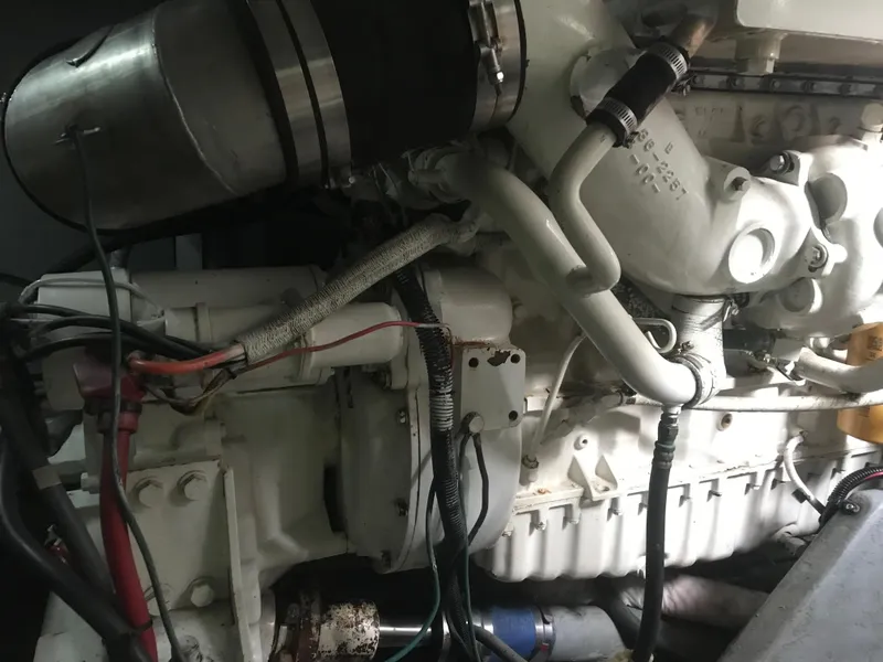 Slide: The Image of Engine of a 1995 Sea Ray 450 Sundancer boat, showcasing intricate mechanical components. - 34