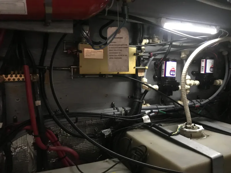 Slide: The Image of Engine room of 1995 Sea Ray 450 Sundancer with wiring and equipment. - 36