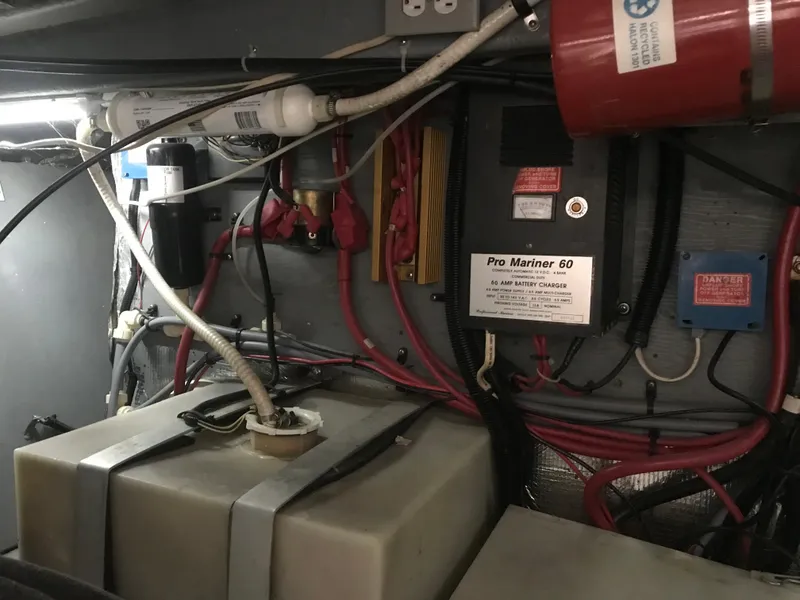 Slide: The Image of Engine room of 1995 Sea Ray 450 Sundancer with wiring and equipment. - 37