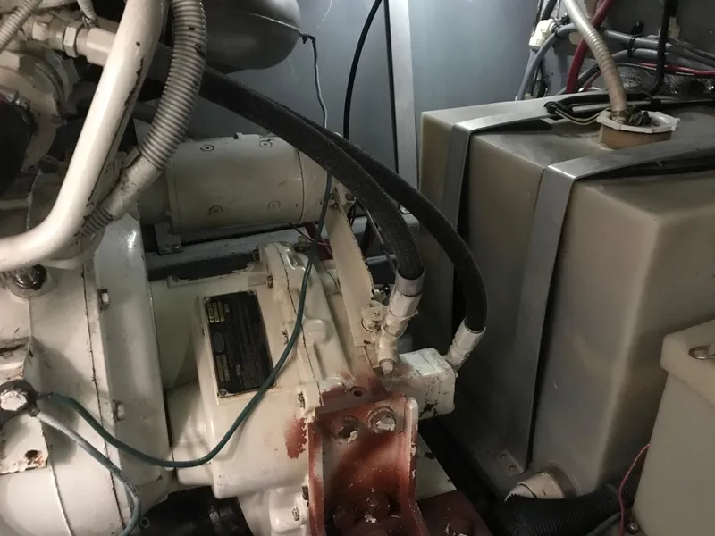 Slide: The Image of Engine room of 1995 Sea Ray 450 Sundancer with visible machinery and components. - 38