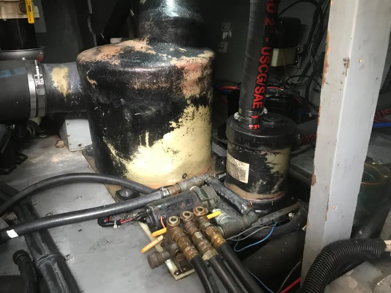 Slide: The Image of Engine room of 1995 Sea Ray 450 Sundancer with visible mechanical components. - 42