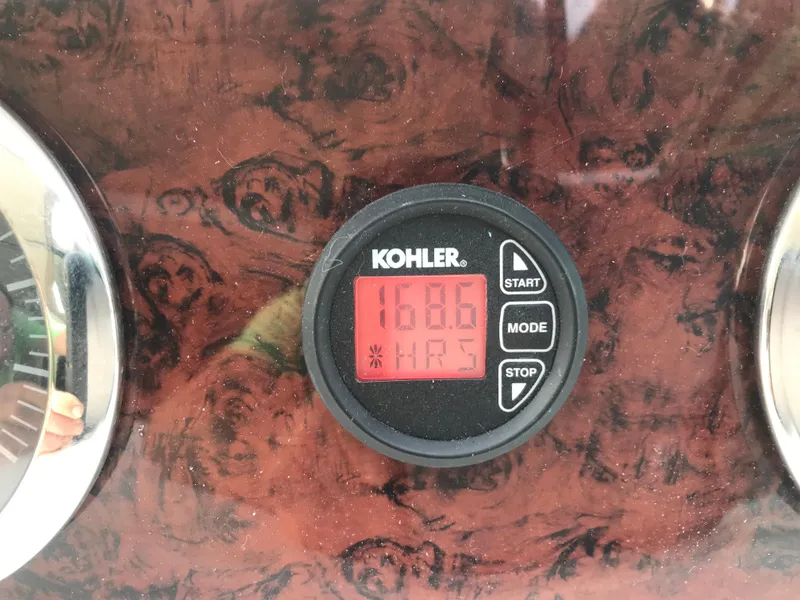 Slide: The Image of Kohler hour meter on 1995 Sea Ray 450 Sundancer, displaying 1686 hours. - 45