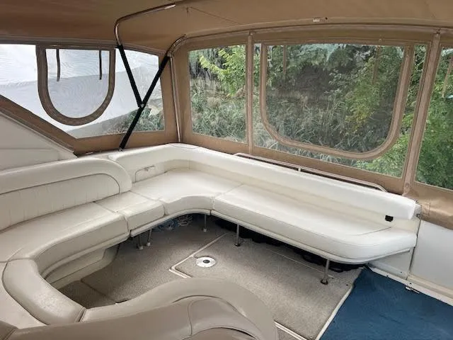 Slide: The Image of Interior of a 1995 Sea Ray 450 Sundancer with white leather seating. - 49