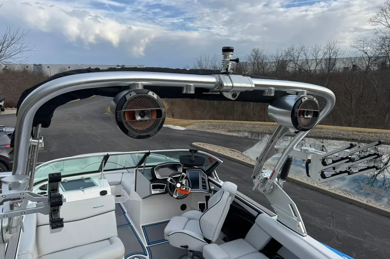 Slide: The Image of 2021 MasterCraft XT22 boat interior with speakers and sleek design. - 12
