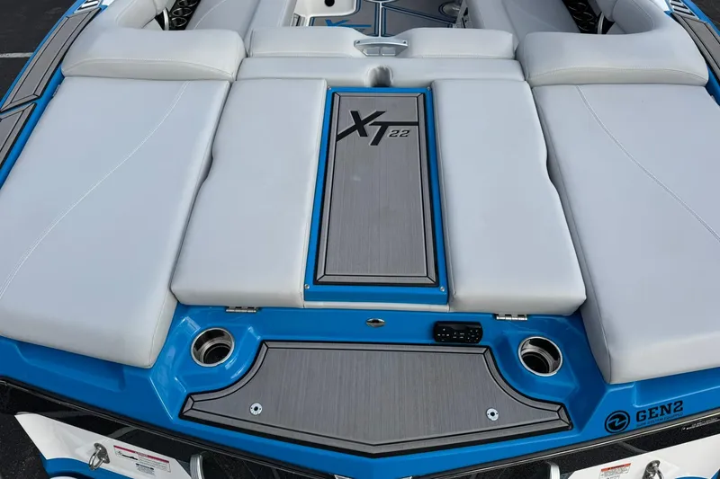 Slide: The Image of 2021 MasterCraft XT22 boat with sleek seating and modern design. - 9