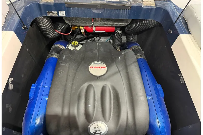Slide: The Image of Engine compartment of 2022 MasterCraft XT24 boat with Ilmor engine components. - 14