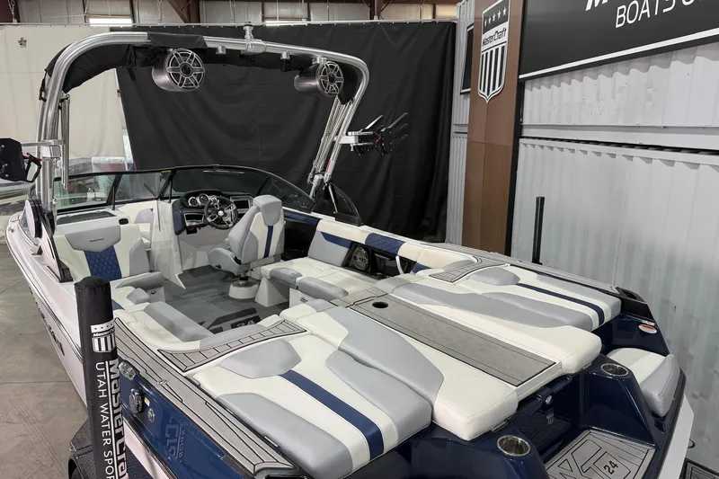 Slide: The Image of 2022 MasterCraft XT24 boat interior with sleek seating and modern design. - 6