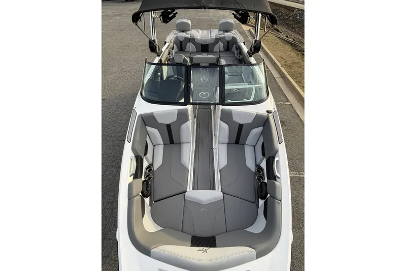 Slide: The Image of 2023 MasterCraft XT24 boat interior with sleek seating and modern design. - 8