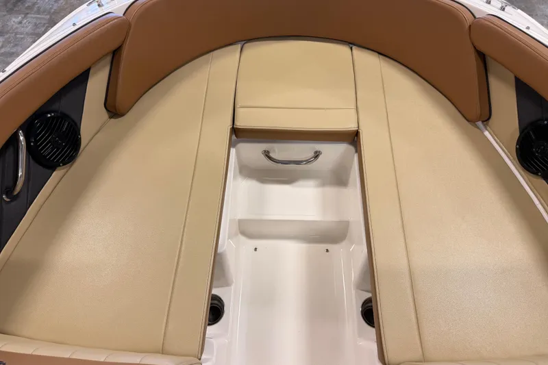 Slide: The Image of 2018 Sea Ray SPX 210 boat interior with tan and brown seating. - 14